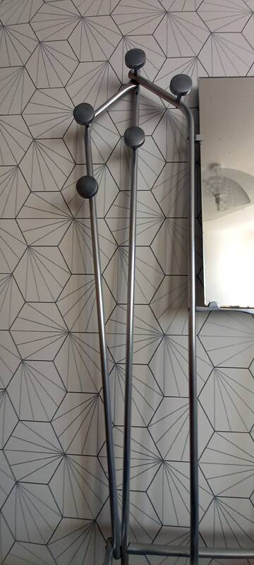 Vintage aluminum wall coat rack.