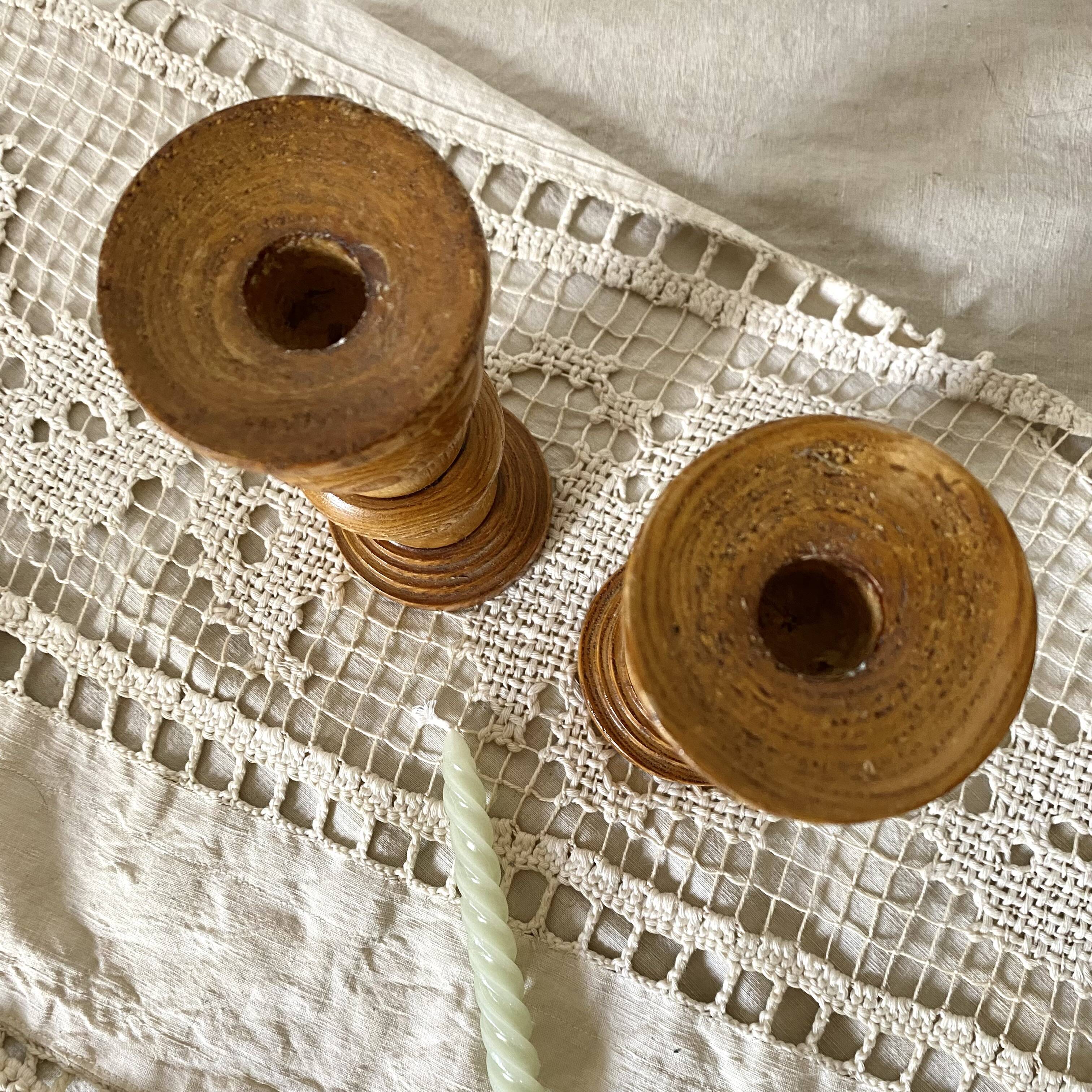 Pair of turned wooden candlesticks