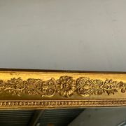 Miroir doré style Restauration à décor de palmettes étirées