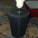 Ovoid lamp sheathed in braided blue leather and saddle stitching