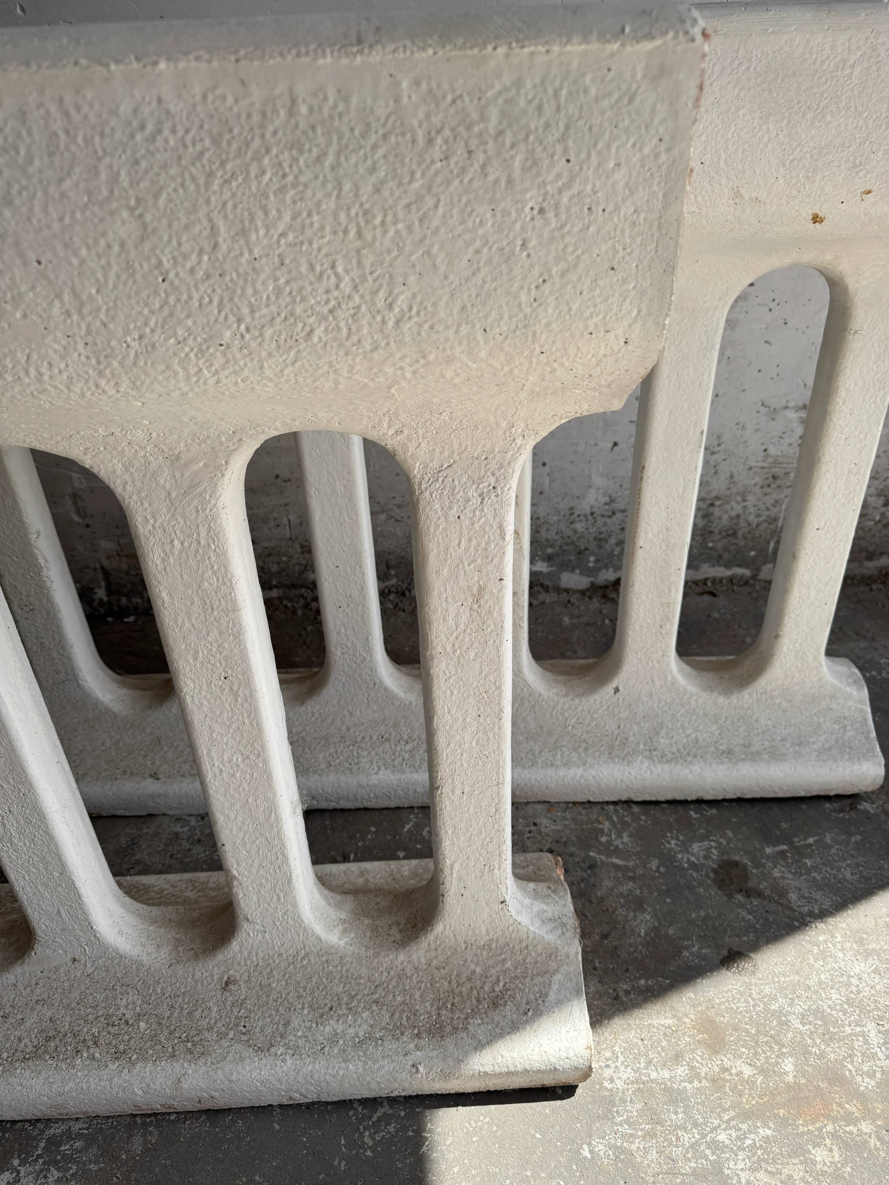 Pair of sculptural cast concrete planters in Off-White, mid-century brutalist style, long and rectangular.