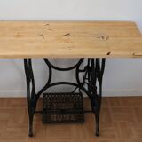 Living room console with sewing machine foot