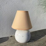 Small cracked white ceramic lamp with flowers.