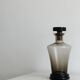 Smoked glass bottle, sculpted stopper