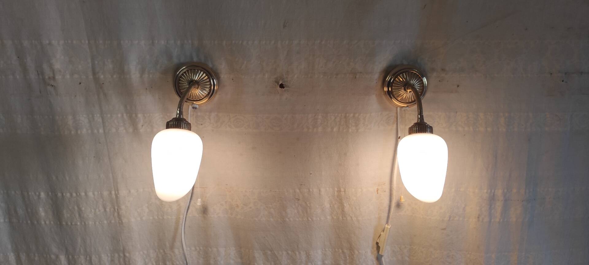 Articulated brass and opaline wall lights - mid 20th century.