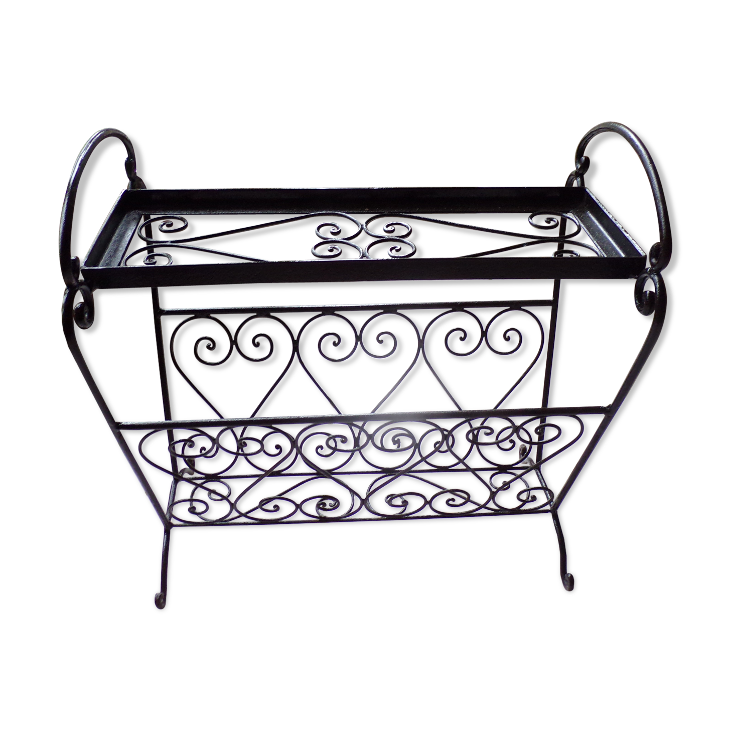 Magazine holder and wrought iron plant