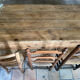 Renovated raw wood farmhouse table