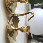 Pair of hand candle holders/Cellar rats shape swans, in polished brass. 1950s