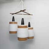 Scandinavian triangle pendant light in cascade with 3 opalines