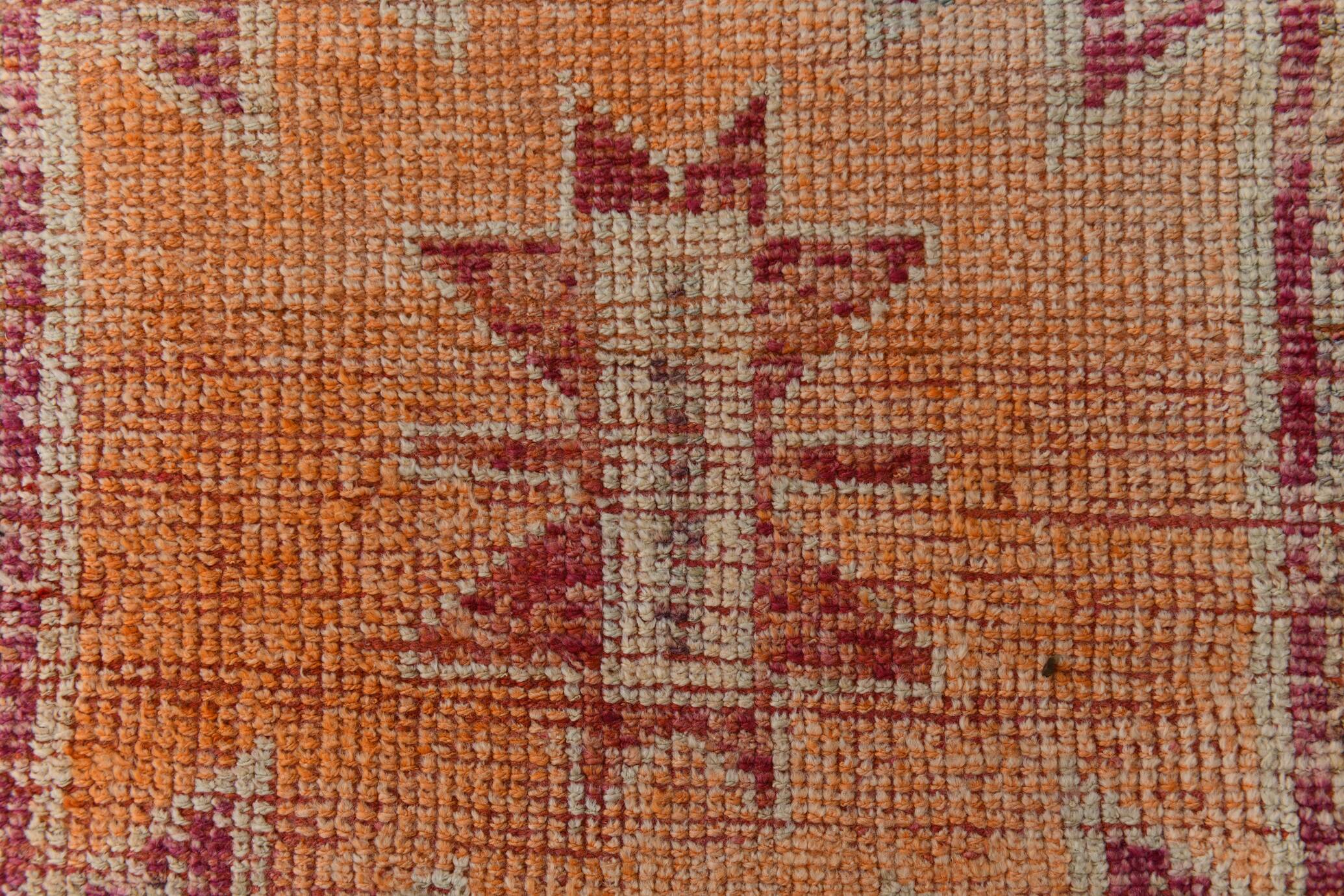 2x12 shades of pale orange vintage runner rug