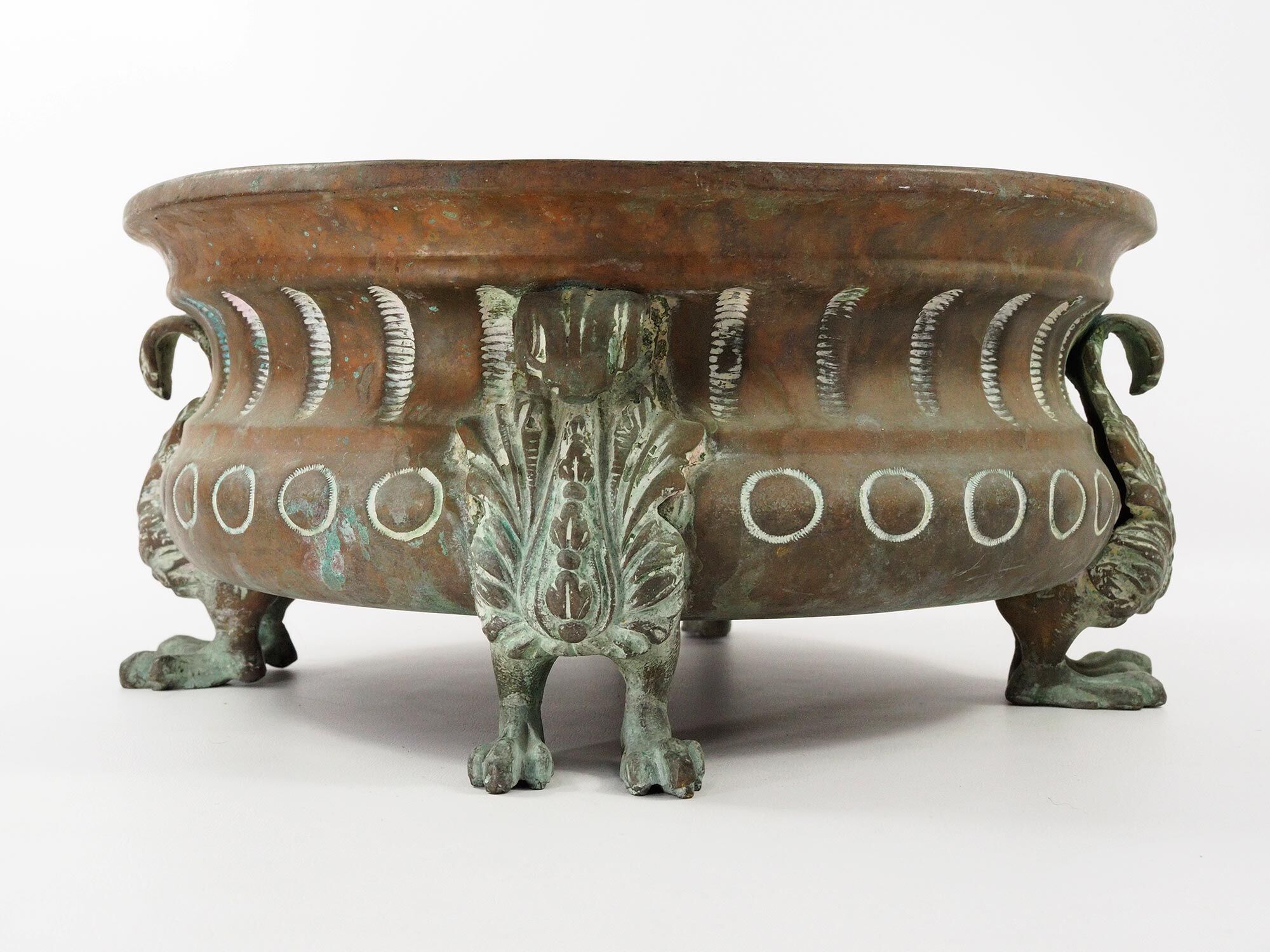 Repelled copper planter with acanthus and cast bronze legs, 1900s