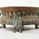 Repelled copper planter with acanthus and cast bronze legs, 1900s