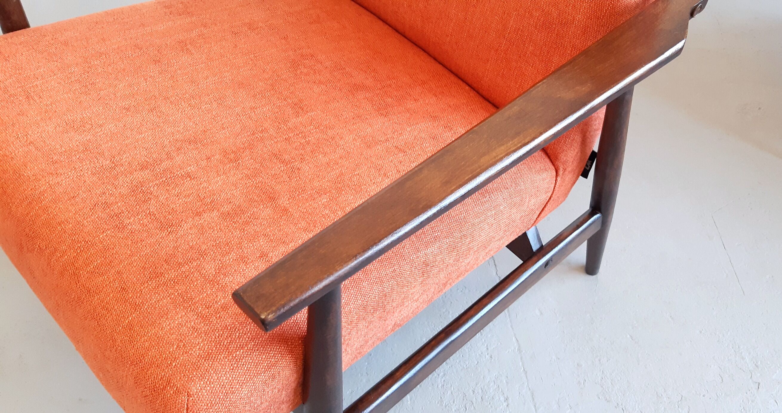 1960 Henryk Lis mid century armchair in rusty orange