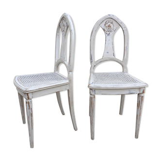 Pair of old white canne chairs