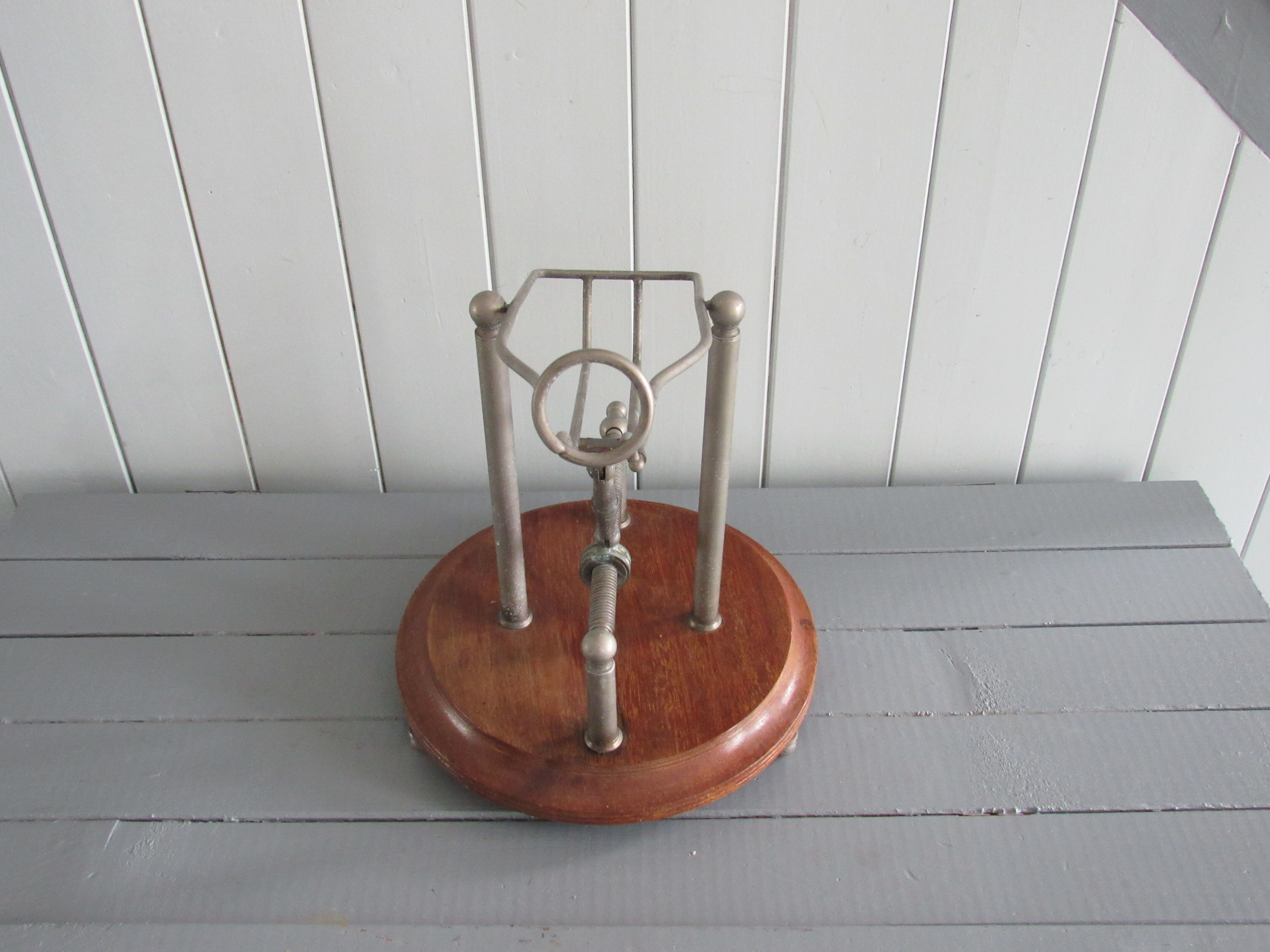 Old mechanical wine decanter on wooden base