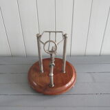 Old mechanical wine decanter on wooden base