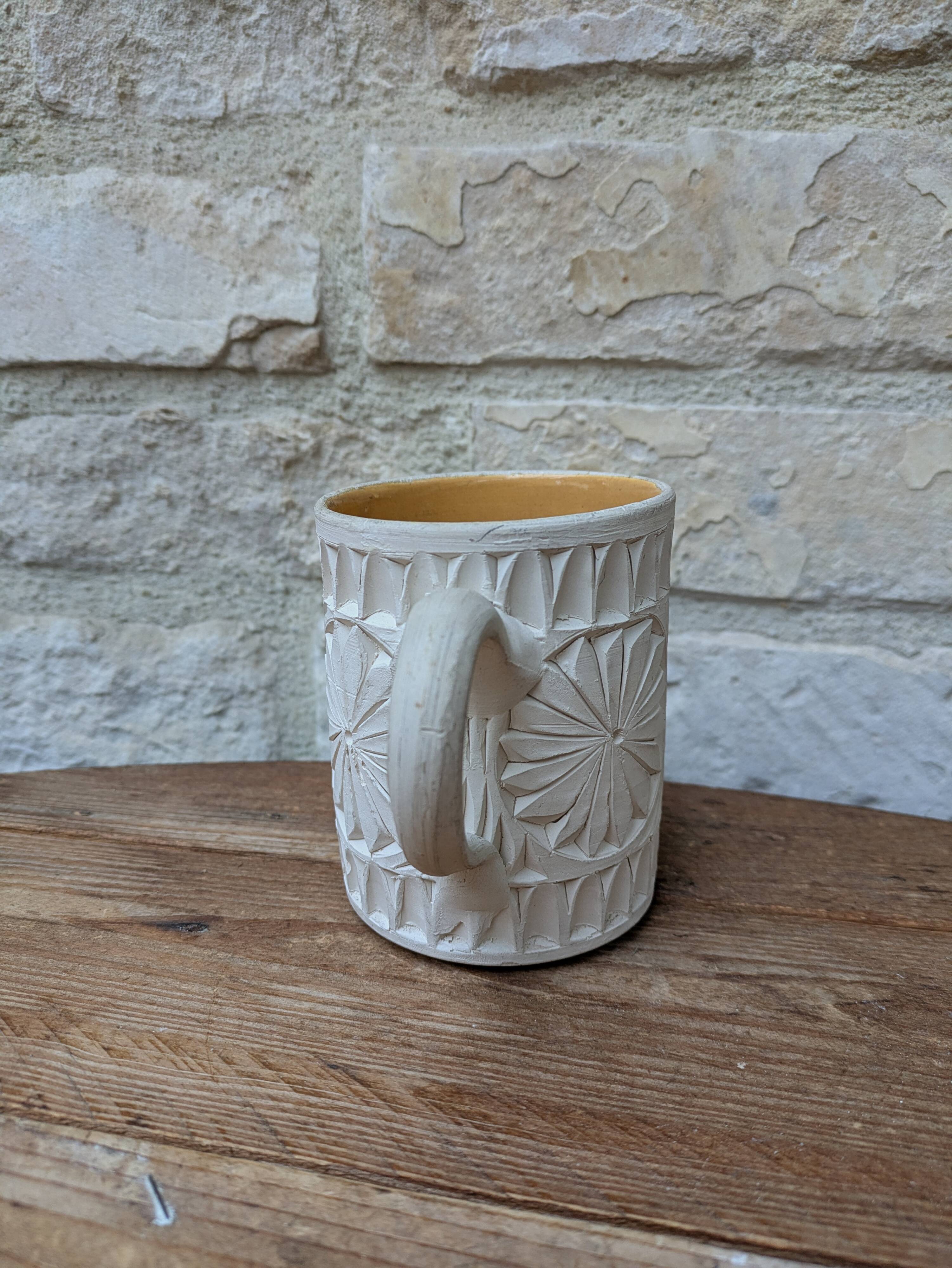 Old terracotta mug with glazed interior