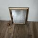 Beveled mirror under gold frame