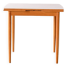 Extendable dining table with clear formica top