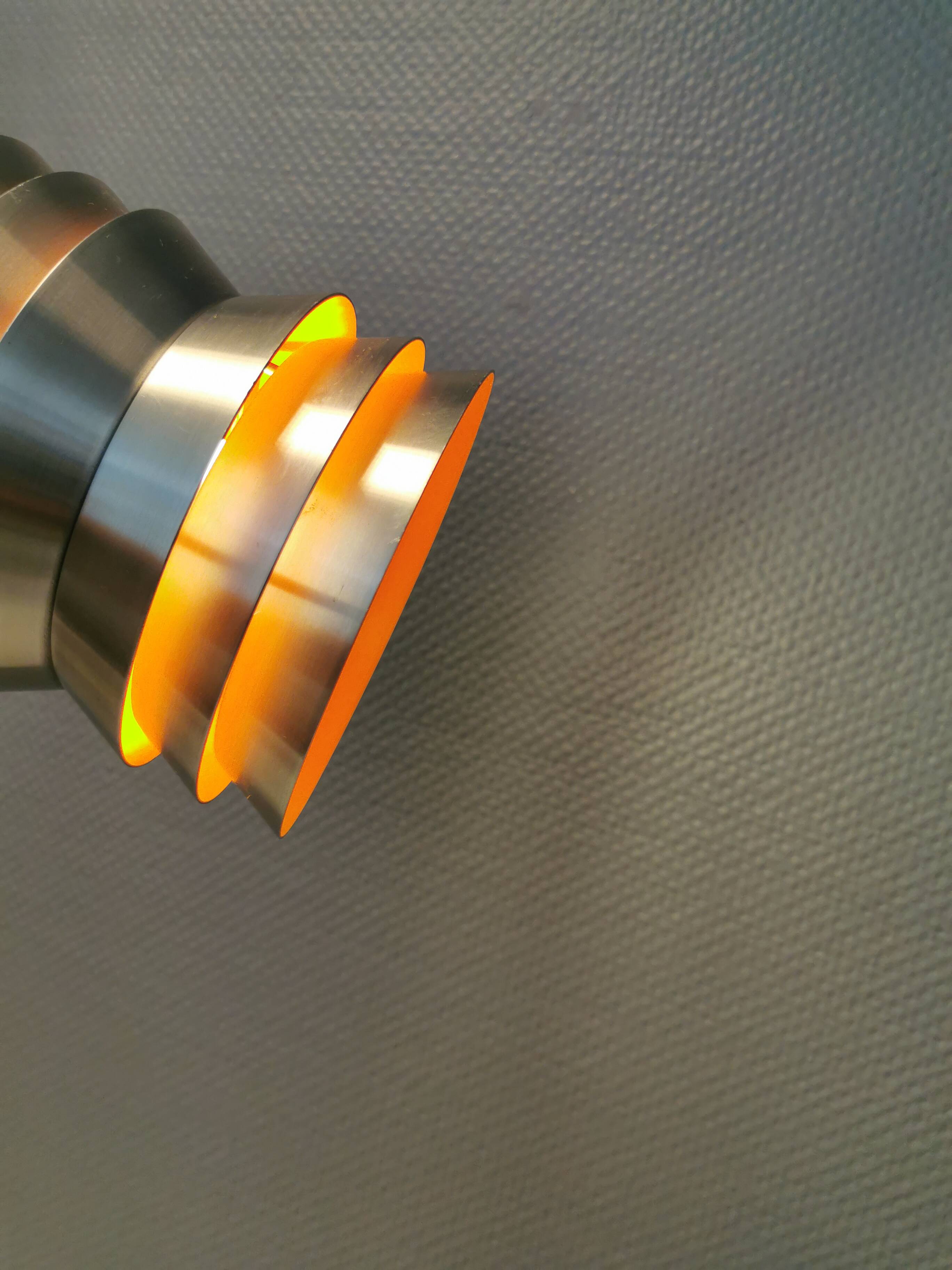 Danish/Swedish hanging lamp, in silver-coloured aluminium with orange interior paint.