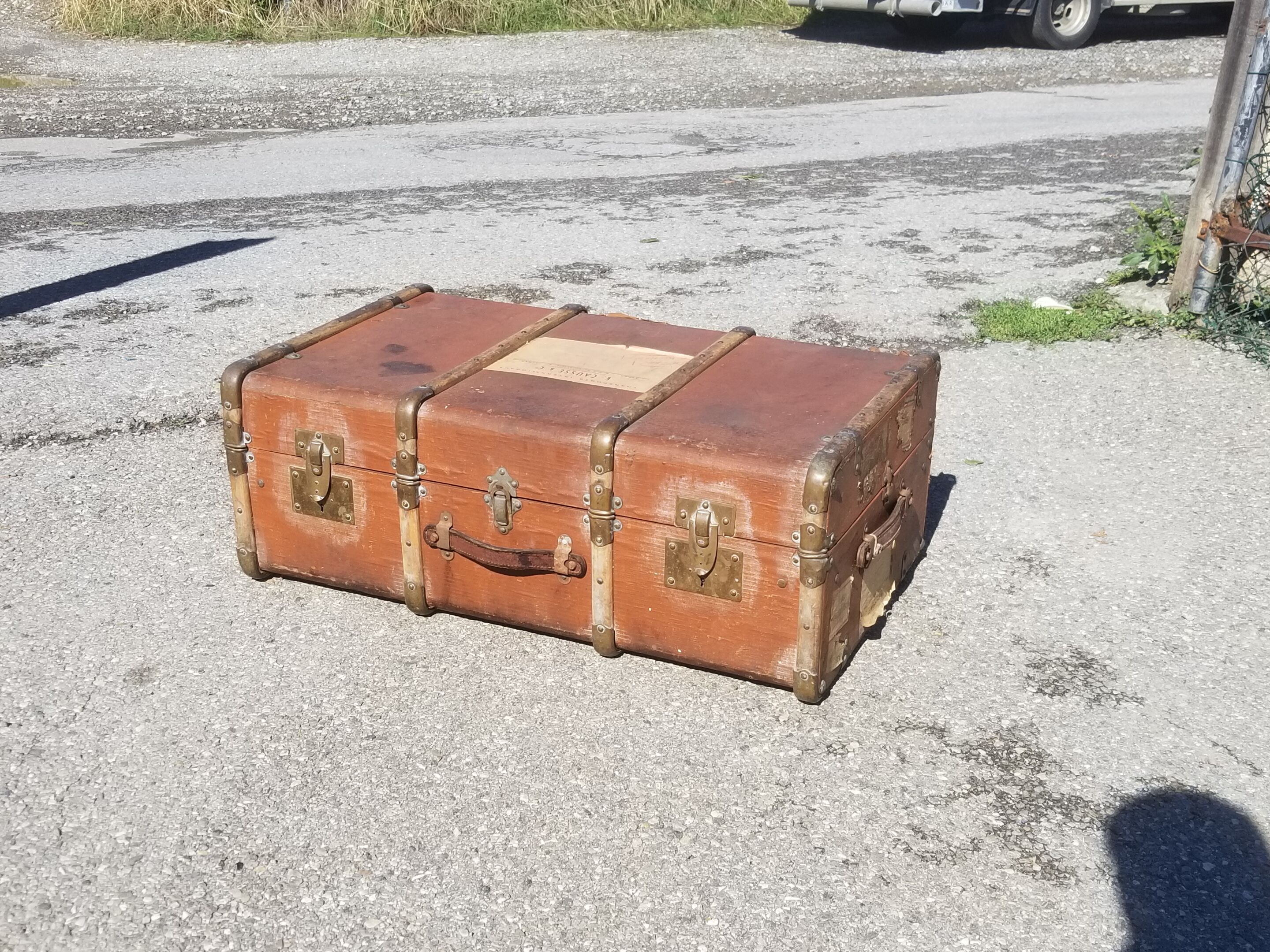 Old travel trunk made of wood and brass