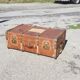 Old travel trunk made of wood and brass