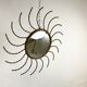 Mid century gold sunburst mirror with convex glass.