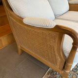 Sofa and armchair in cane and wood by Jean Roche