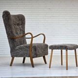 1960s, reupholstered Danish armchair, with stool, genuine sheepskin.