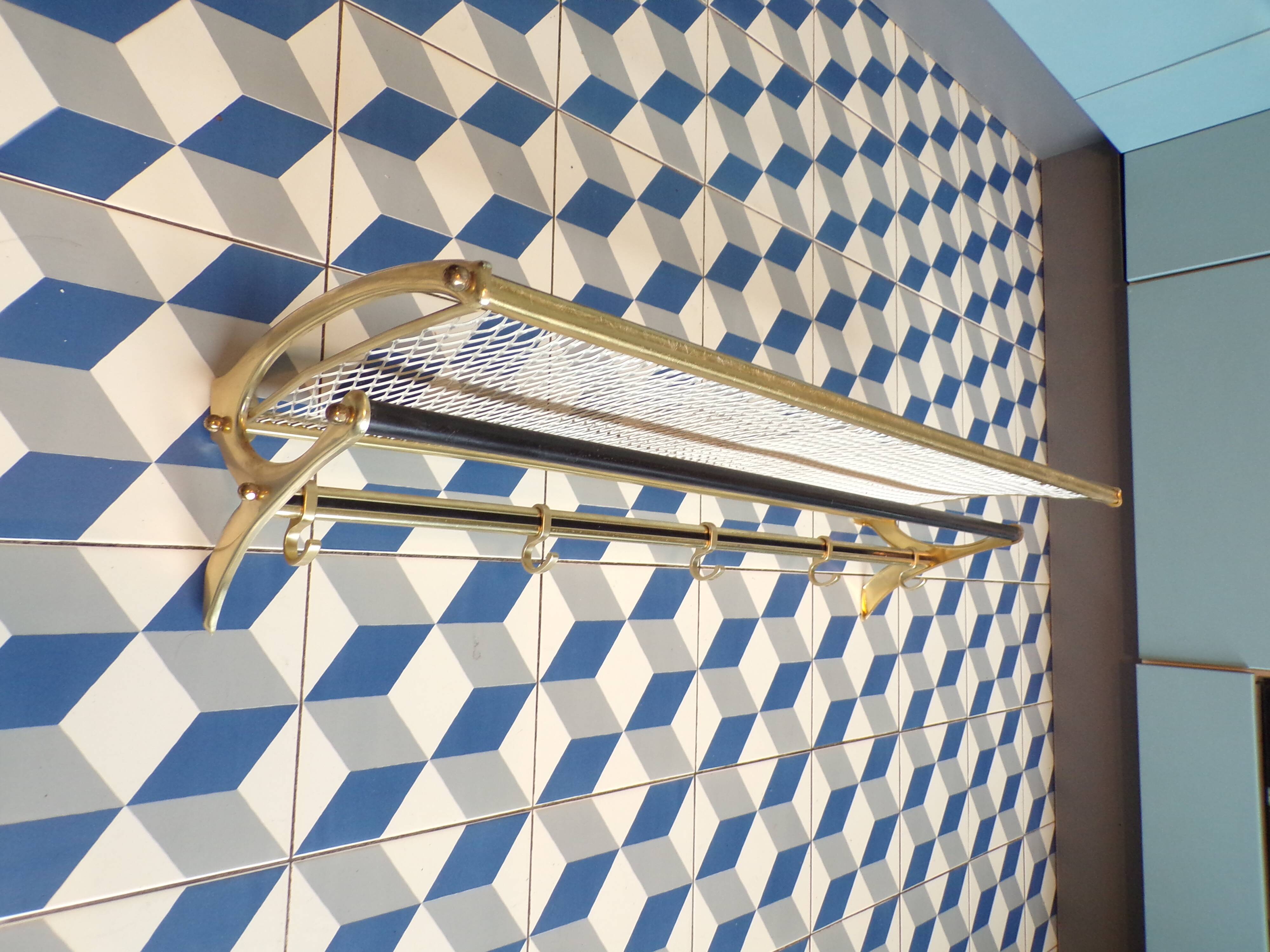 Vintage coat rack in the style of a train luggage rack.