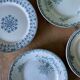 Set of 6 old flat plates in mismatched iron earth