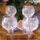 4 lead crystal wine glasses with slender baluster stems.