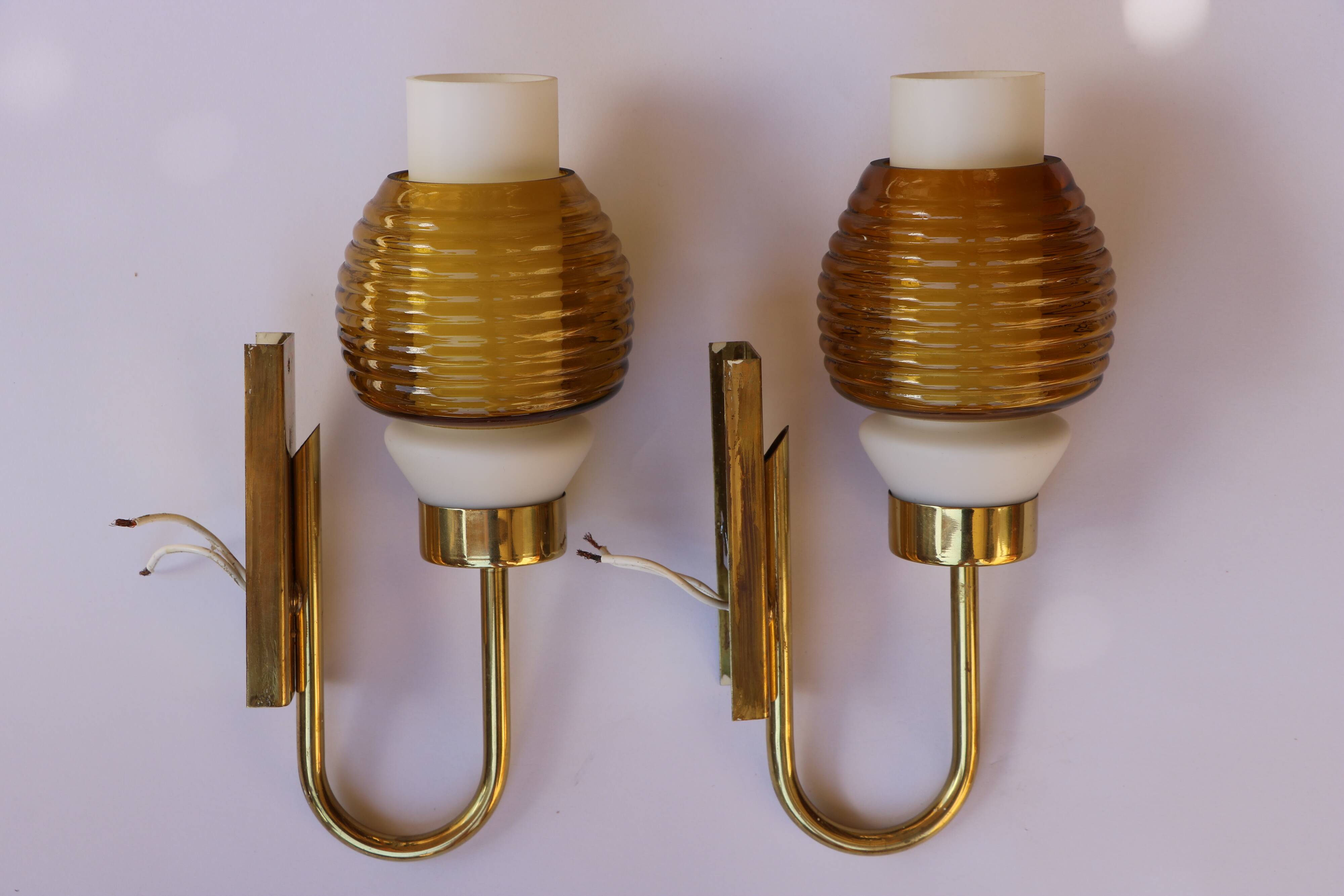 Pair of Scandinavian wall sconces, brass, opal glass and amber glass.