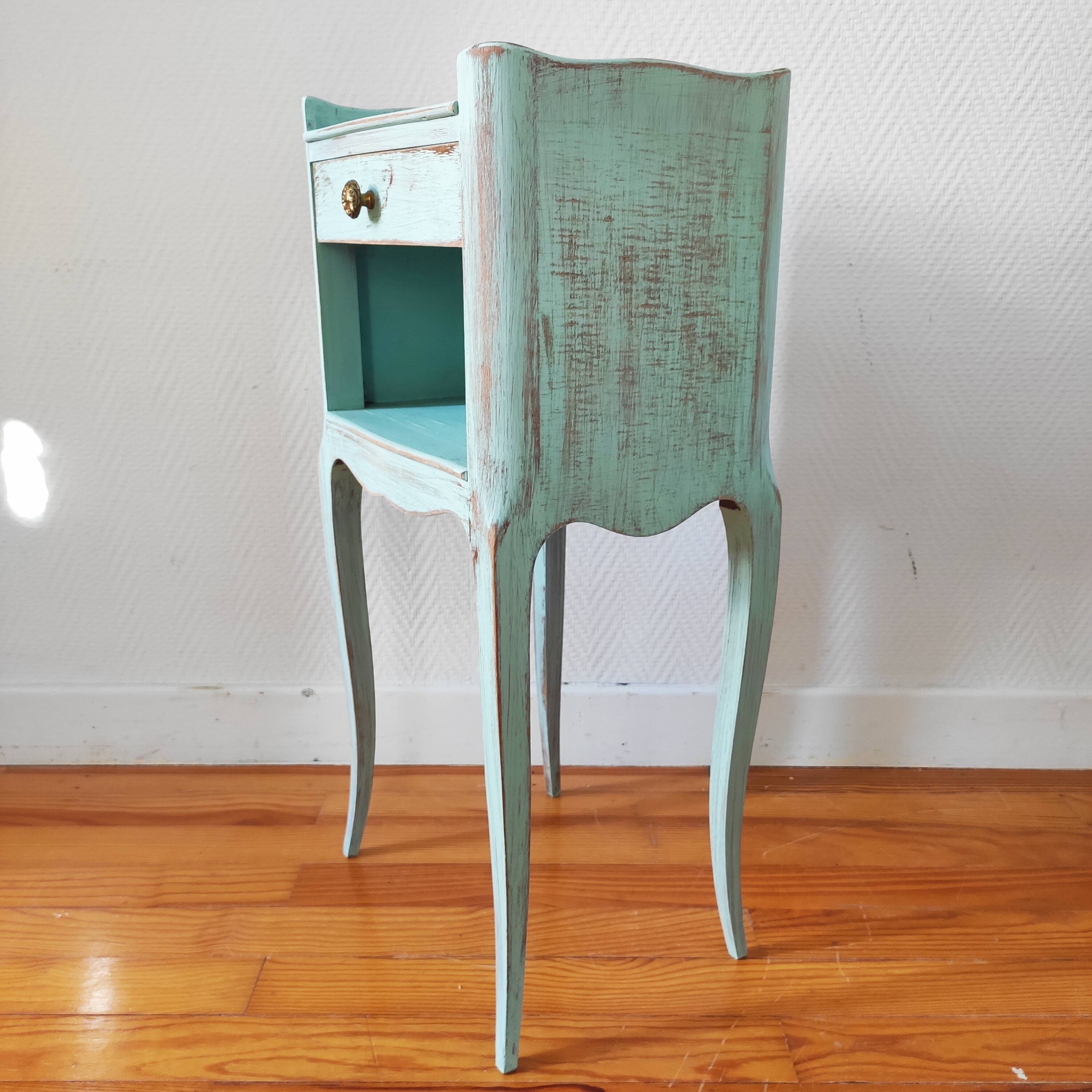 Patinated bedside table end of sofa