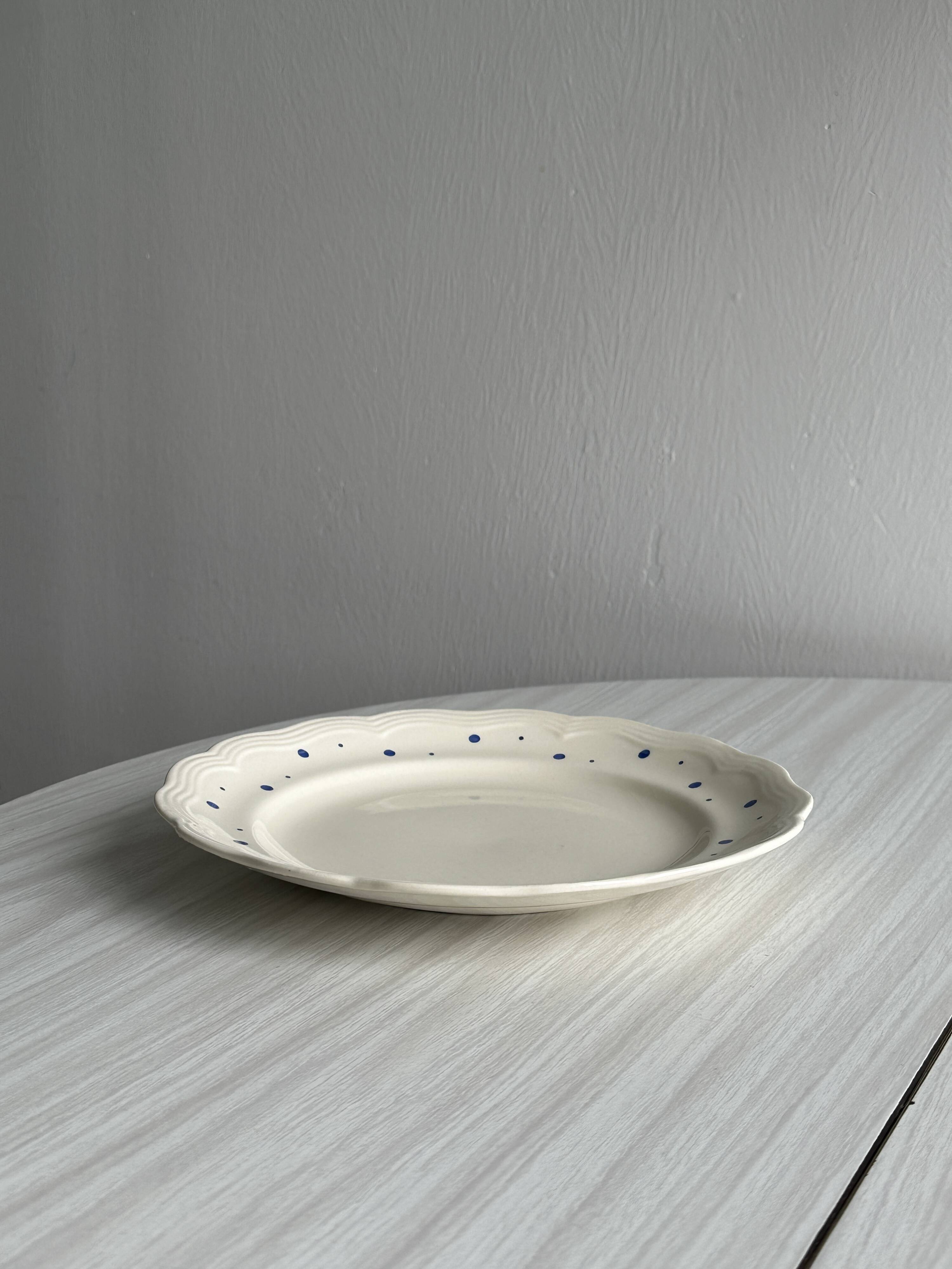 Vintage blue polka dot plate with scalloped edge