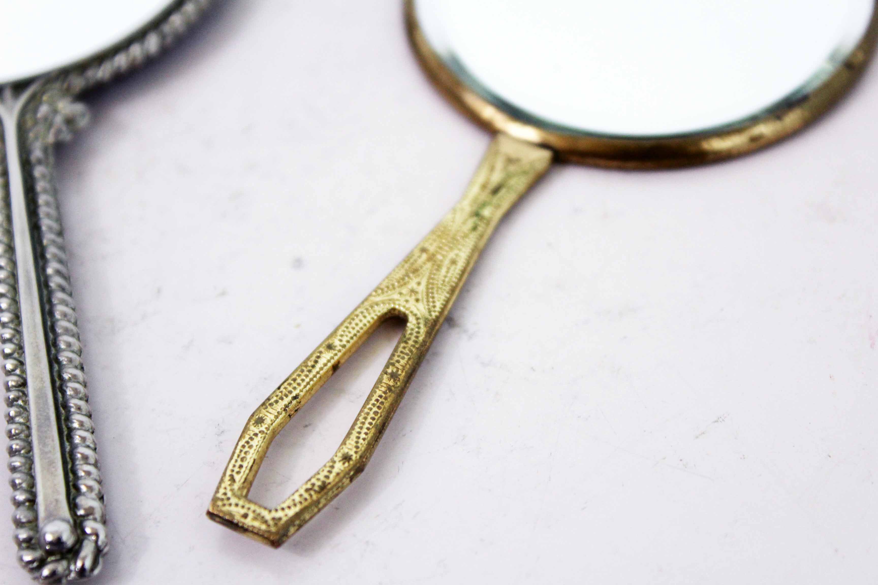 Old hand mirror duo
