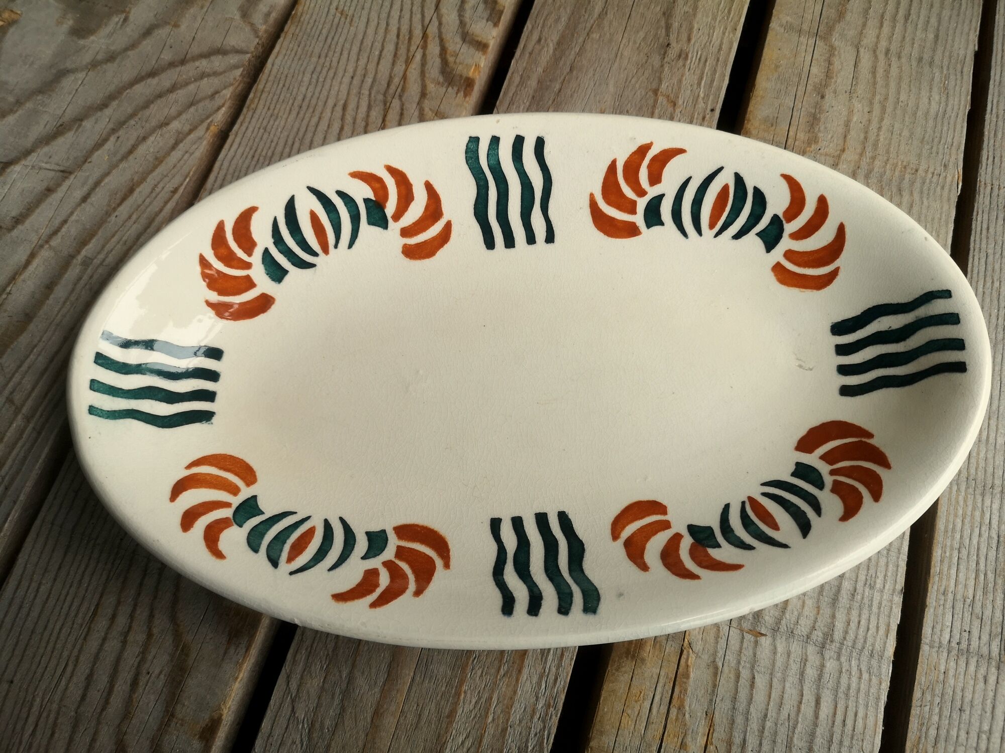 Dish out of ceramics decor orange and green
