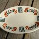 Plat à hors d'oeuvre en céramique décor orange et vert