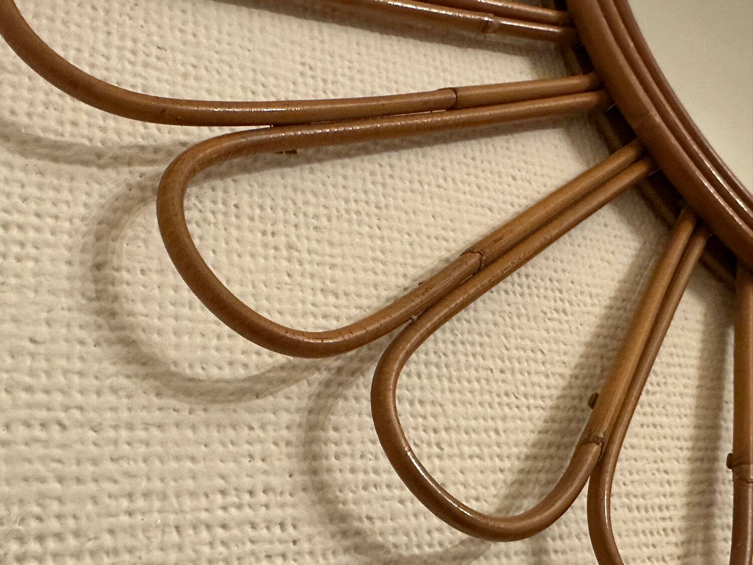 Old vintage asymmetrical round rattan mirror