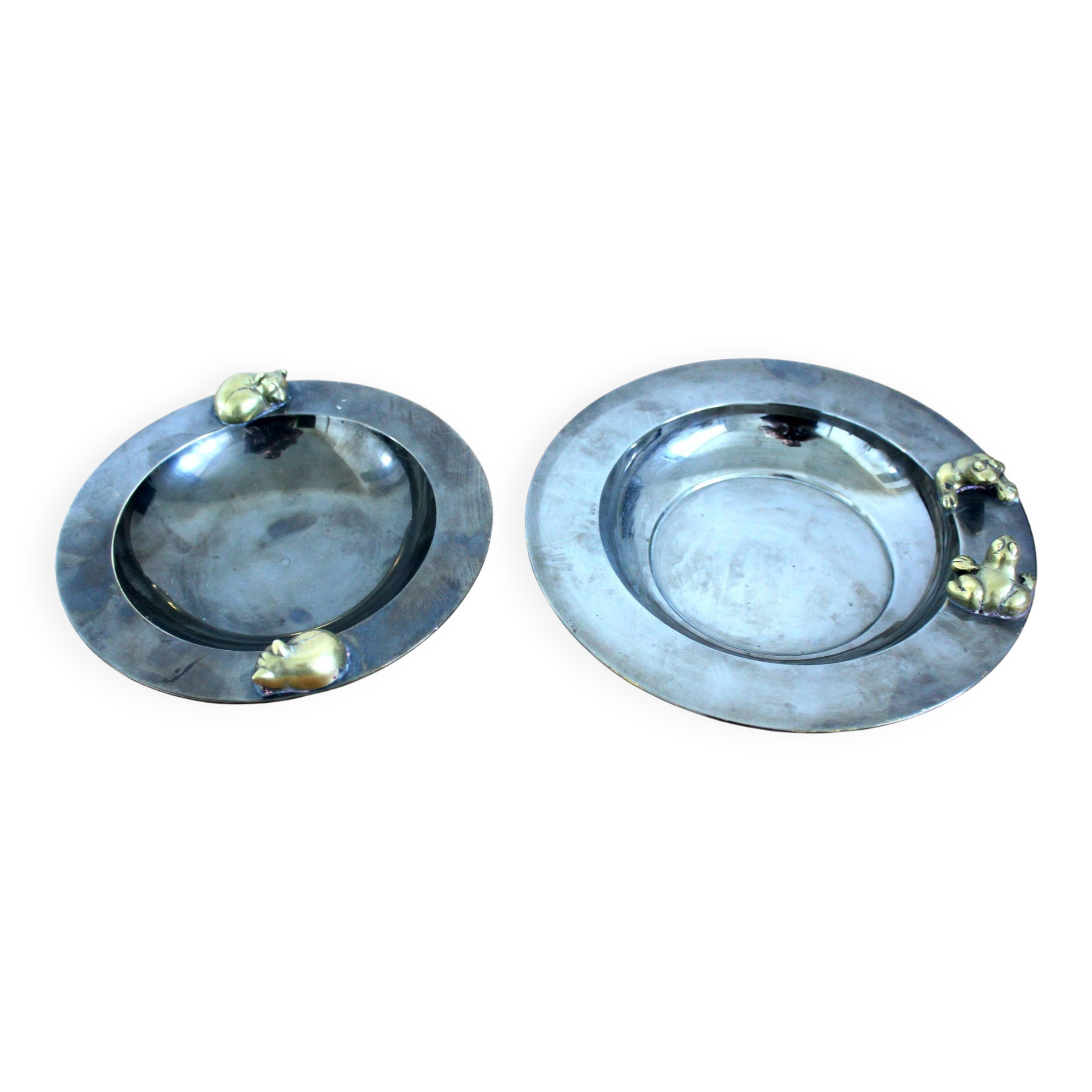 2 antique round serving trays with bronze handles and chrome finish.