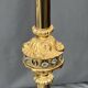 Baroque-style floor lamp in solid gilded bronze decorated with crystal pendants.