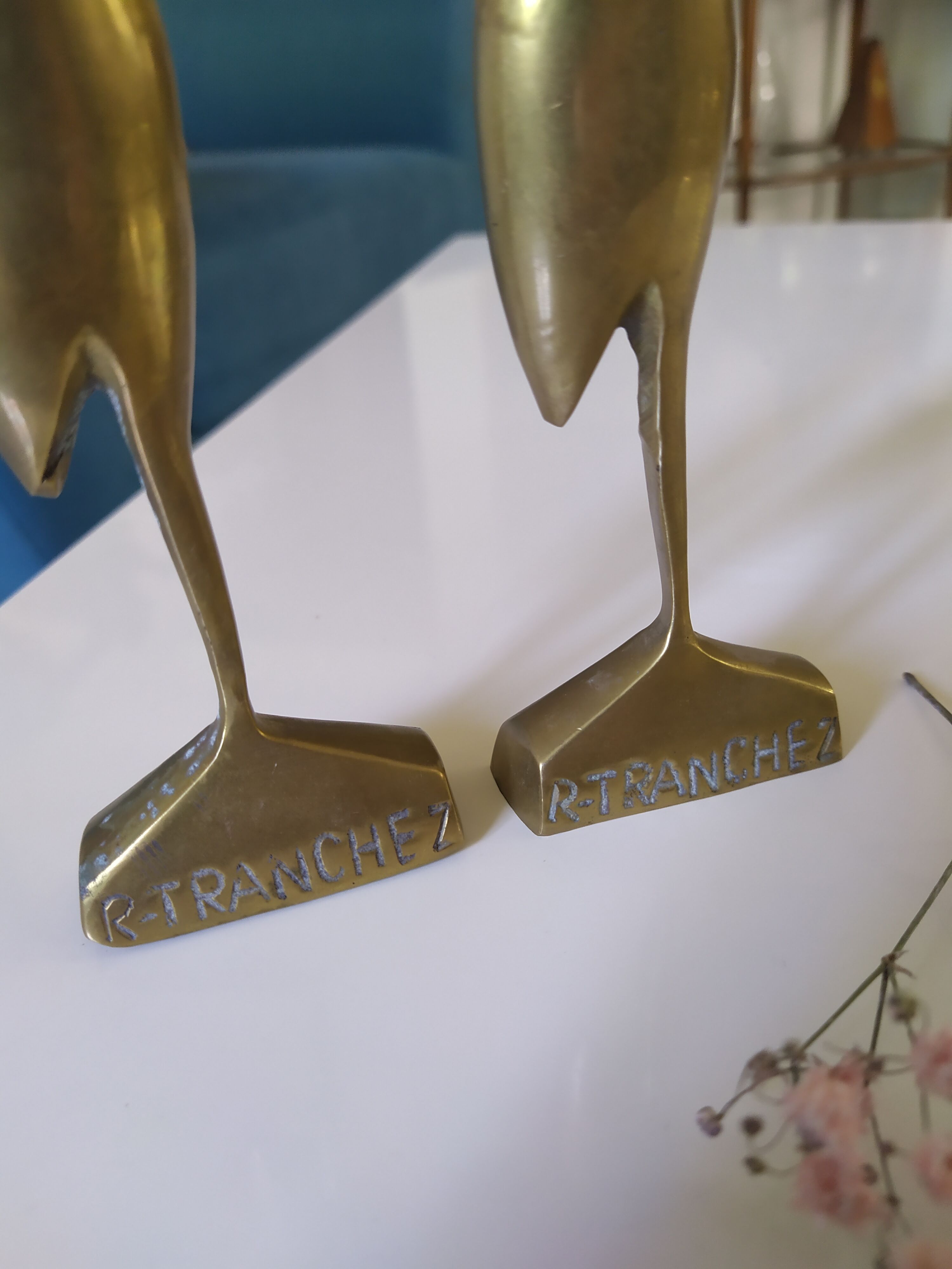 Coupled with brass herons