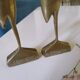 Coupled with brass herons