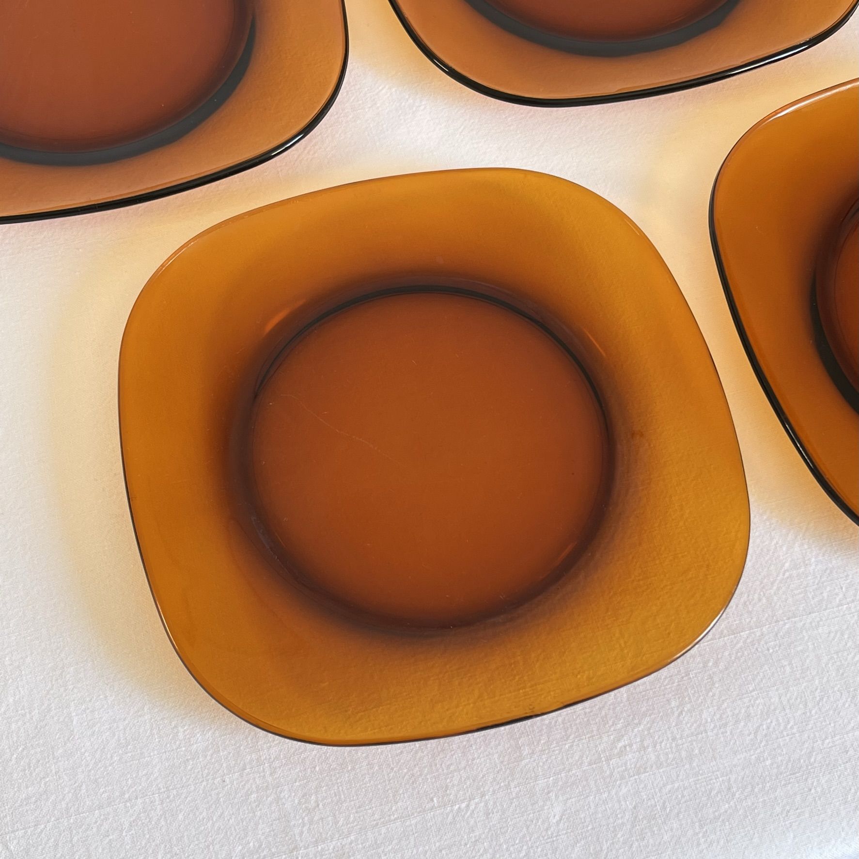 Set of 10 square Vereco plates in amber glass