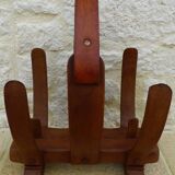 Unique piece of a magazine rack or log rack in solid oak pegged with leather handle