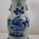 China. Porcelain mallet vase with blue and white phoenix decoration on a rock.