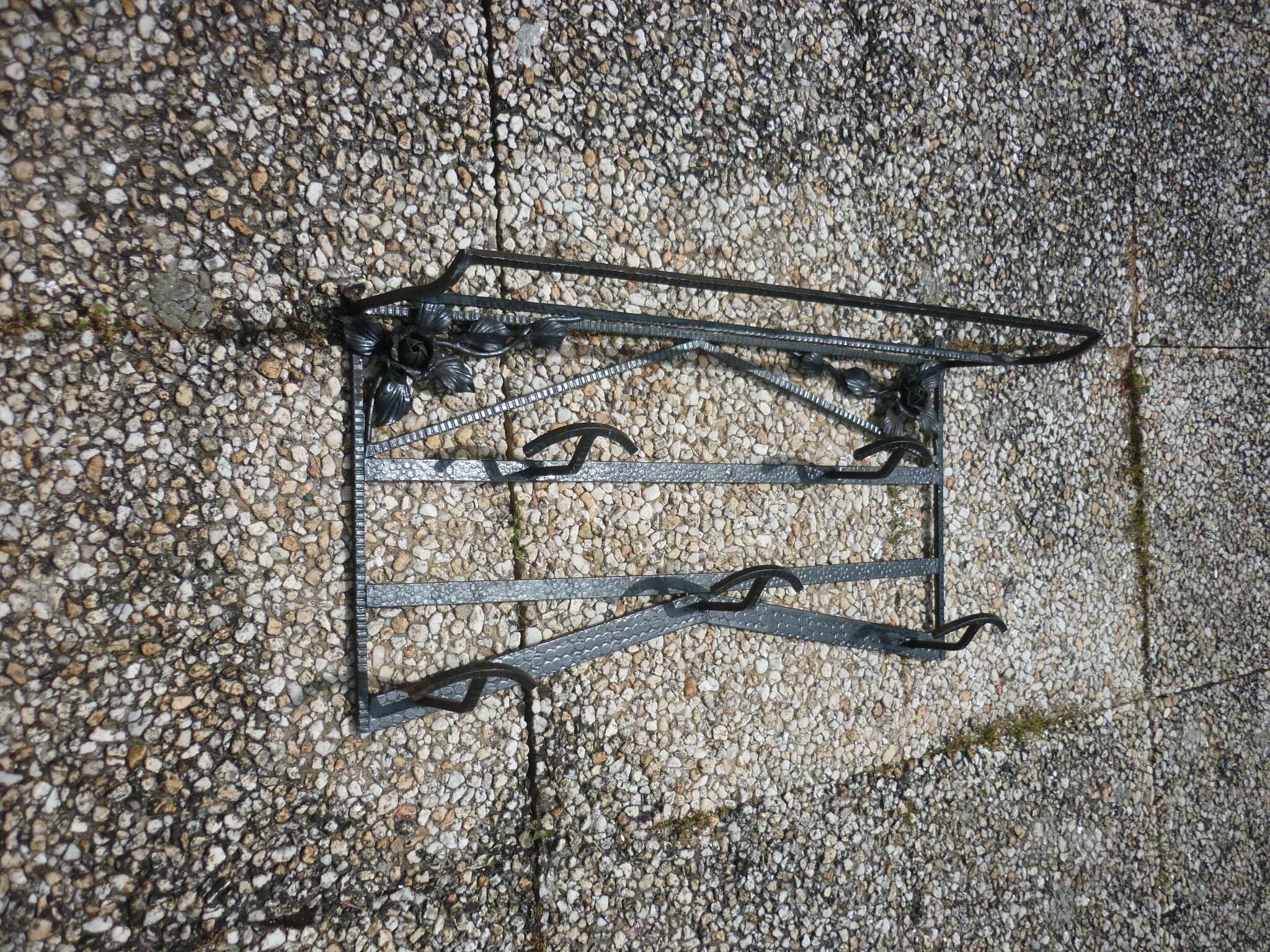 Wrought iron vest and a shelf with a hat