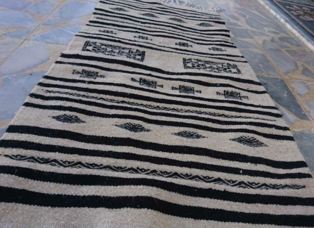 Beige and black handmade carpet, 110x55cm