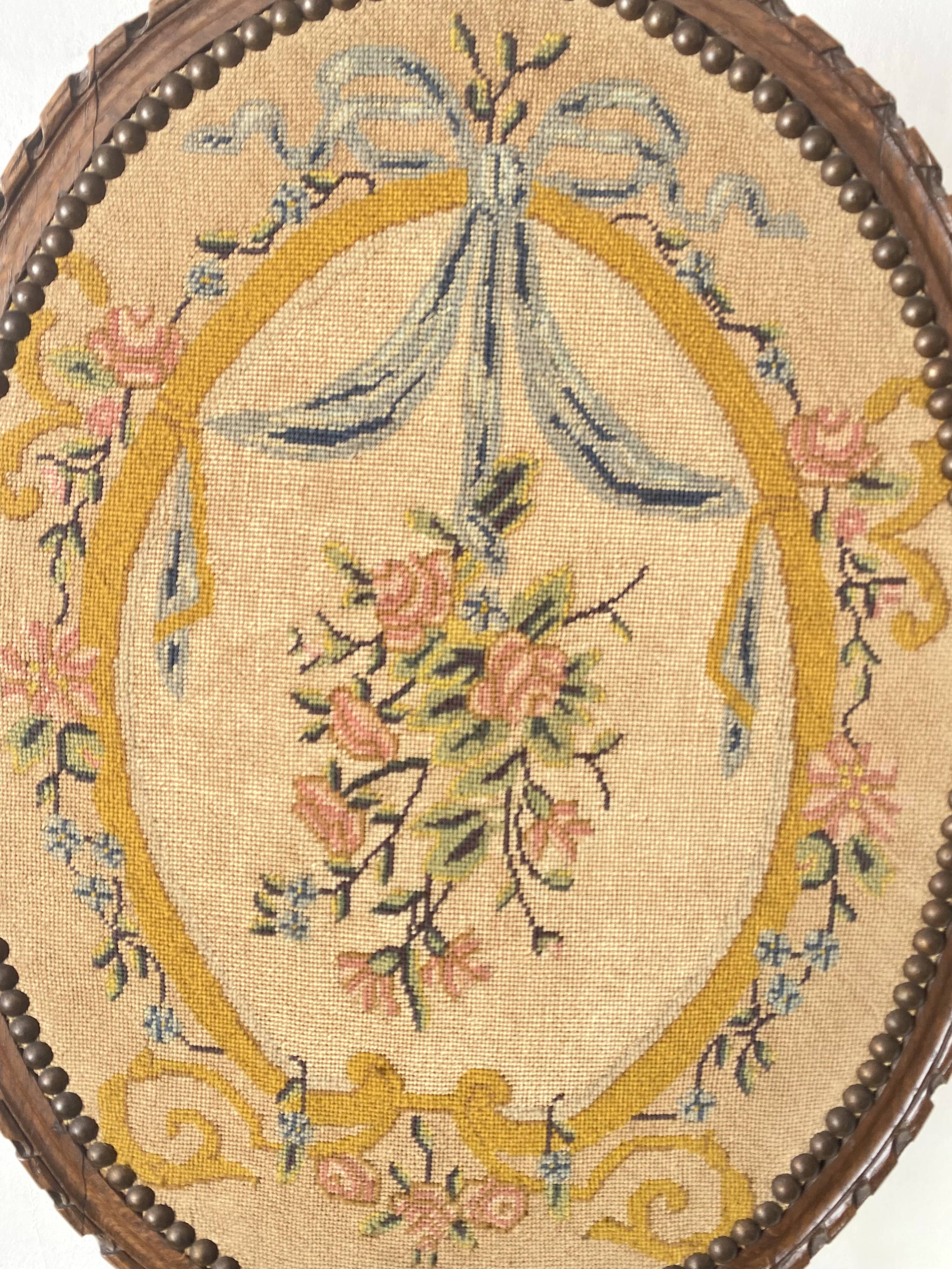 Wooden and embroidered fabric fireplace screen