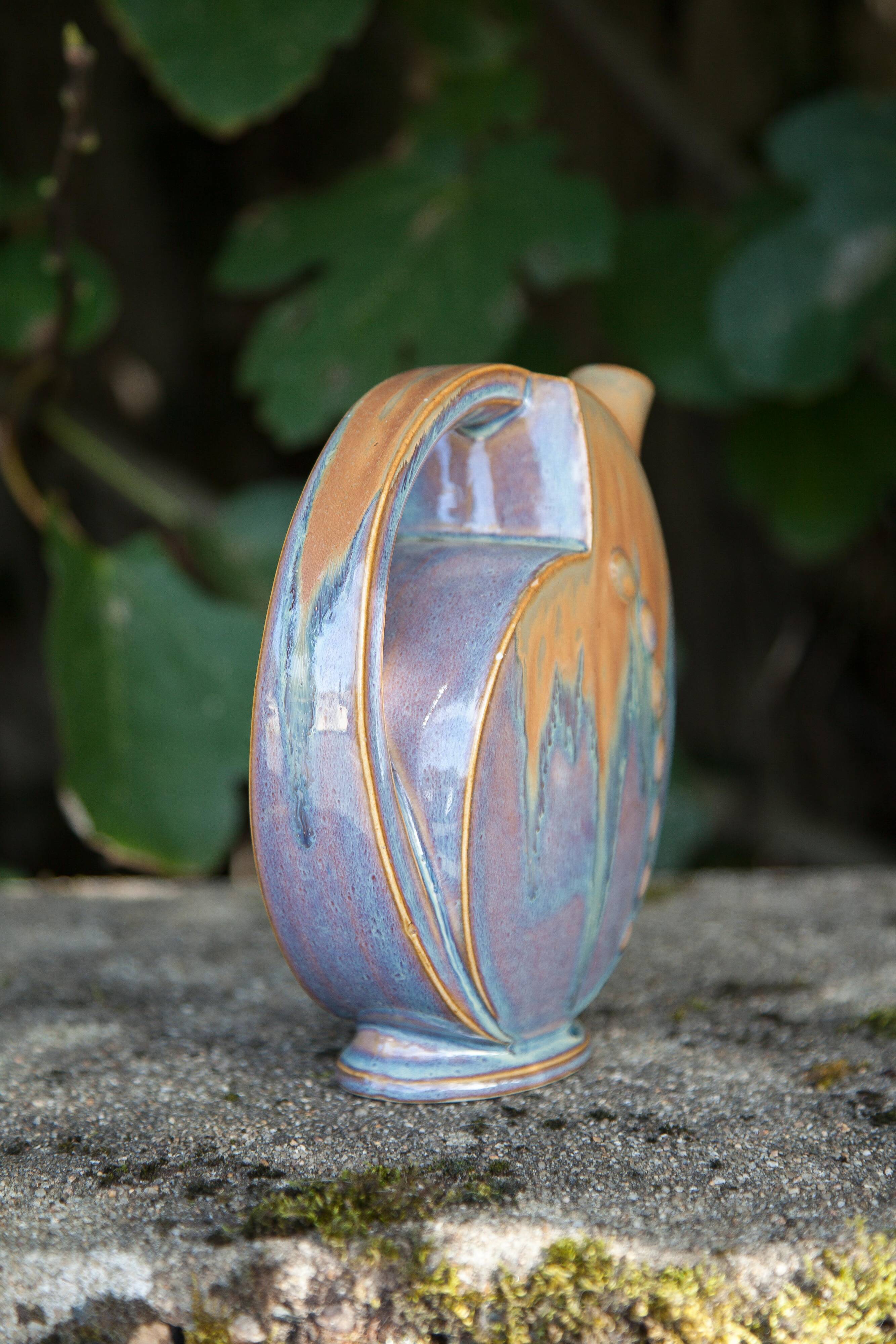 Flamed enameled stoneware bottle, pitcher, liquor bottle signed Denbac number 610, art vase